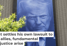 A banner featuring President Trump on the outside of the DOJ building in Washington, D.C. Andrew Harnik/Getty Images